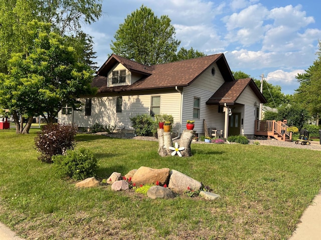 320 State St Unit A, Dresser, WI 54009 - view of front facade featuring a front yard, a shingled roof, and a wooden deck