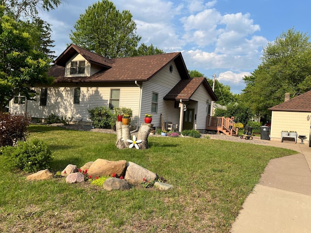 320 State St Unit A, Dresser, WI 54009 - view of front of home with a front yard, roof with shingles, and a wooden deck