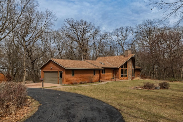 34126 County 115, Canton Twp, MN 55939 - view of front of property with driveway, a chimney, a front yard, and roof with shingles