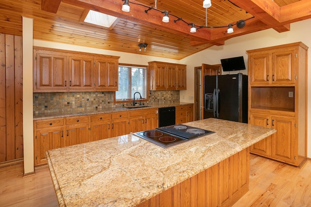 34126 County 115, Canton Twp, MN 55939 - kitchen featuring black appliances, a sink, wood ceiling, a skylight, and light wood finished floors