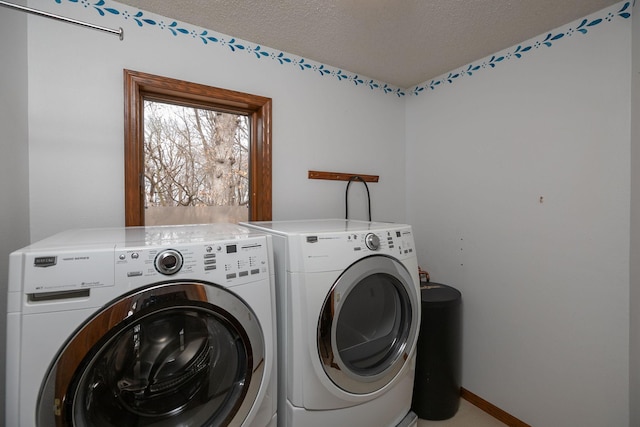 34126 County 115, Canton Twp, MN 55939 - clothes washing area with washer and clothes dryer, a textured ceiling, and baseboards