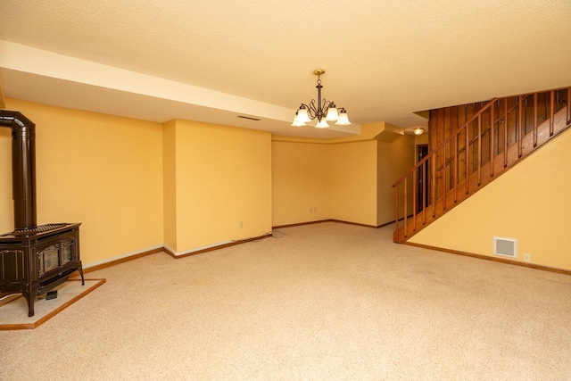 34126 County 115, Canton Twp, MN 55939 - unfurnished living room featuring stairs, carpet, a textured ceiling, a chandelier, and baseboards