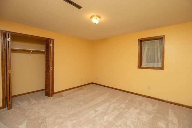 34126 County 115, Canton Twp, MN 55939 - unfurnished bedroom featuring light carpet, baseboards, and a closet