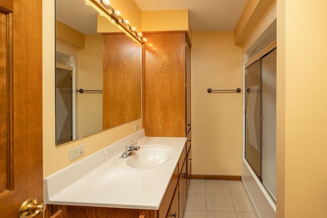 34126 County 115, Canton Twp, MN 55939 - bathroom with vanity, tile patterned flooring, and bath / shower combo with glass door