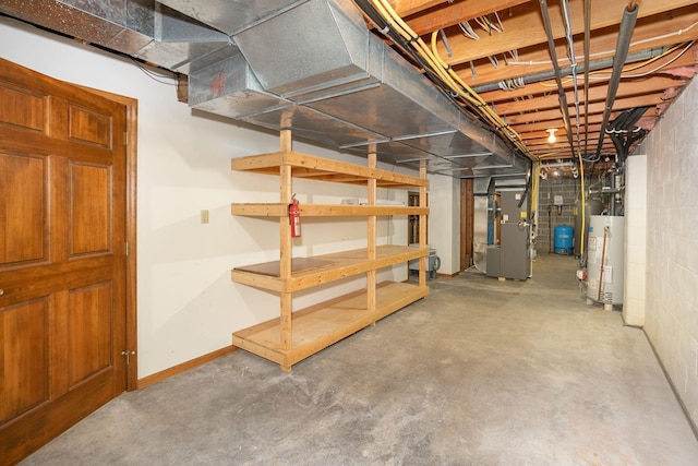 34126 County 115, Canton Twp, MN 55939 - unfinished basement with water heater, heating unit, and a water pressure tank