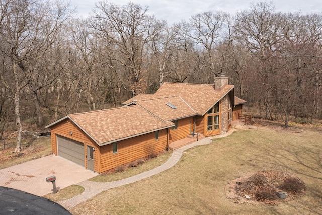 34126 County 115, Canton Twp, MN 55939 - view of front of property featuring a shingled roof, driveway, a chimney, a front lawn, and an attached garage