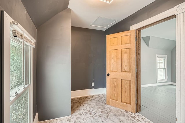 1907 University Ave NE, Minneapolis, MN 55418 - corridor featuring attic access, baseboards, vaulted ceiling, and wood finished floors