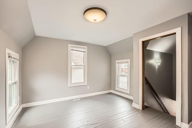 1907 University Ave NE, Minneapolis, MN 55418 - additional living space featuring vaulted ceiling, hardwood / wood-style flooring, and baseboards