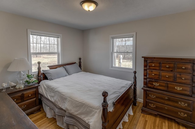 2730 State 371 SW, Pine River, MN 56474 - bedroom featuring light wood-style flooring and multiple windows