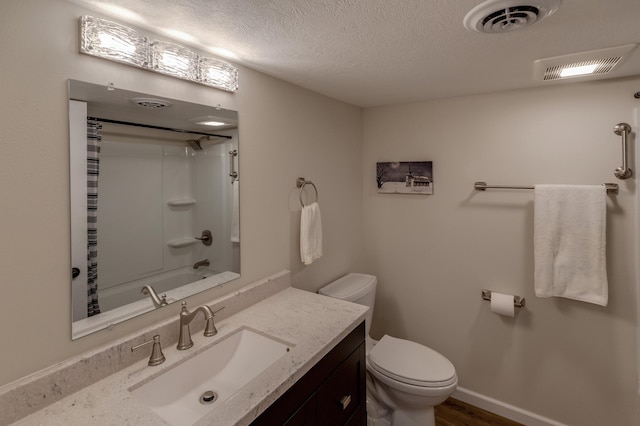 2730 State 371 SW, Pine River, MN 56474 - full bath featuring visible vents, a textured ceiling, vanity, and toilet