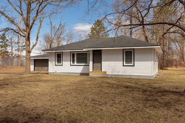 2730 State 371 SW, Pine River, MN 56474 - view of front of house featuring a front lawn, roof with shingles, fence, and a detached garage