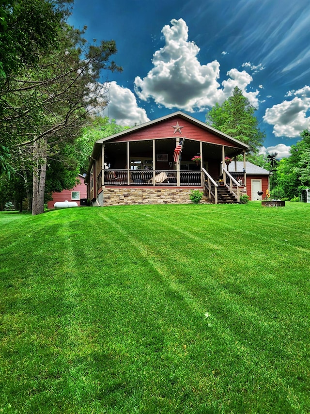 23660 Cap Endres Rd NE, Cass Lake, MN 56633 - rear view of property featuring a yard and a porch