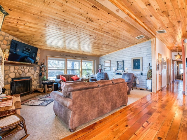 23660 Cap Endres Rd NE, Cass Lake, MN 56633 - living area featuring wooden ceiling, lofted ceiling, a fireplace, and wood-type flooring