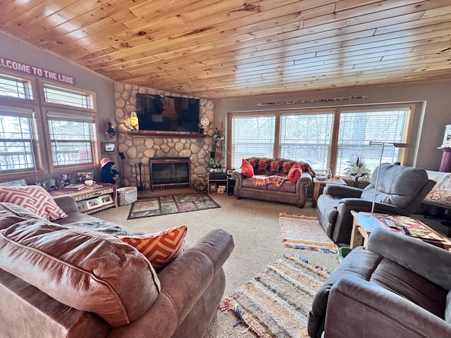 23660 Cap Endres Rd NE, Cass Lake, MN 56633 - carpeted living room with wood ceiling, ornamental molding, and a stone fireplace