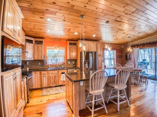 23660 Cap Endres Rd NE, Cass Lake, MN 56633 - kitchen with stainless steel appliances, a sink, a center island, healthy amount of natural light, and wood ceiling