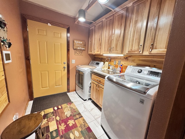 23660 Cap Endres Rd NE, Cass Lake, MN 56633 - laundry area featuring separate washer and dryer and cabinet space