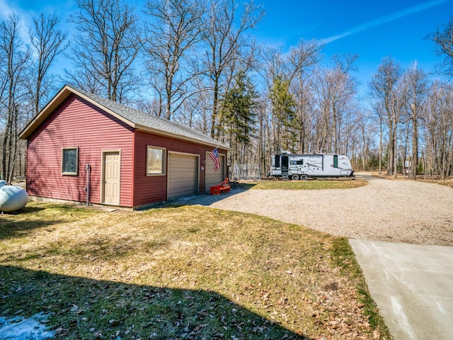 23660 Cap Endres Rd NE, Cass Lake, MN 56633 - view of side of home featuring driveway and a lawn
