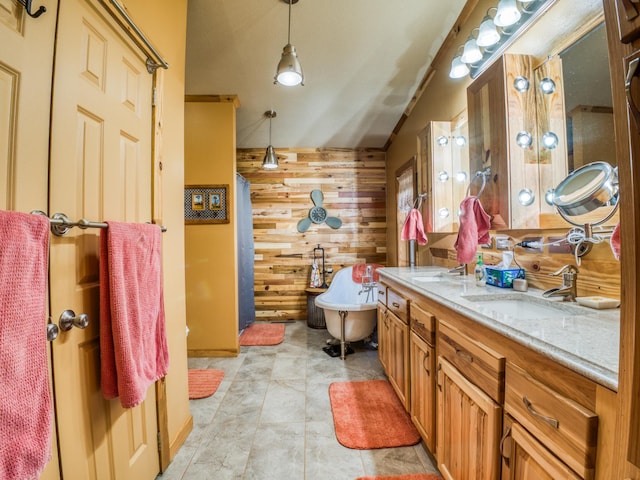 23660 Cap Endres Rd NE, Cass Lake, MN 56633 - full bath with wooden walls, double vanity, and a freestanding bath