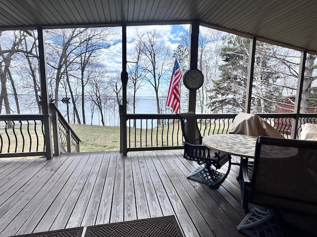 23660 Cap Endres Rd NE, Cass Lake, MN 56633 - wooden deck featuring a water view, a yard, and outdoor dining space