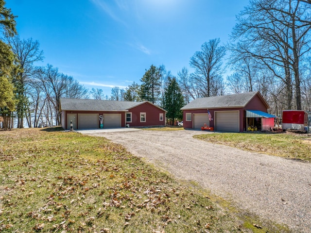 23660 Cap Endres Rd NE, Cass Lake, MN 56633 - view of front of home featuring a detached garage, a front lawn, an outdoor structure, and driveway