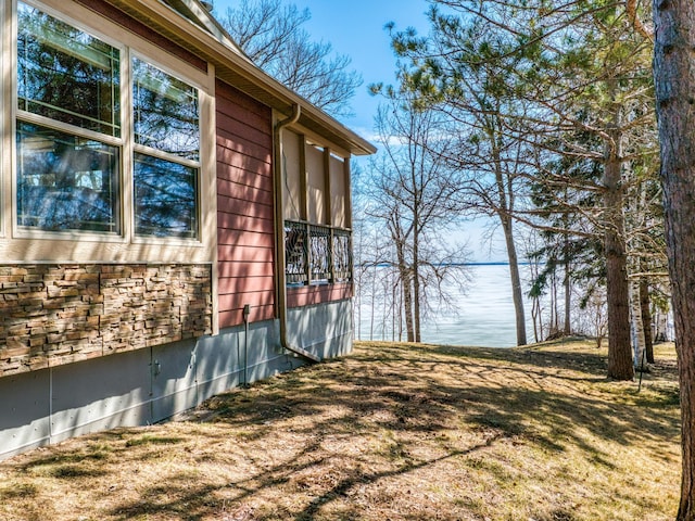23660 Cap Endres Rd NE, Cass Lake, MN 56633 - view of side of home with a water view and stone siding