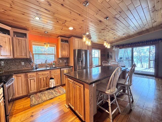 23660 Cap Endres Rd NE, Cass Lake, MN 56633 - kitchen featuring stainless steel appliances, wooden ceiling, a sink, a kitchen island, and a breakfast bar