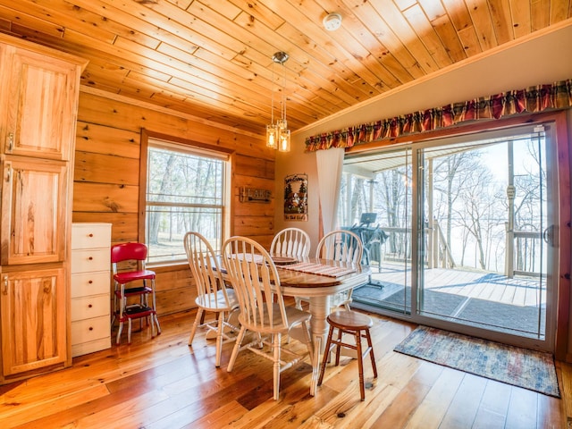 23660 Cap Endres Rd NE, Cass Lake, MN 56633 - dining room with wooden ceiling, light wood-style flooring, and crown molding