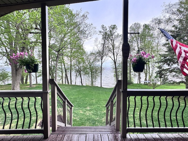 23660 Cap Endres Rd NE, Cass Lake, MN 56633 - wooden terrace featuring a water view and a lawn