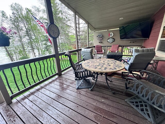 23660 Cap Endres Rd NE, Cass Lake, MN 56633 - deck featuring a lawn and outdoor dining area