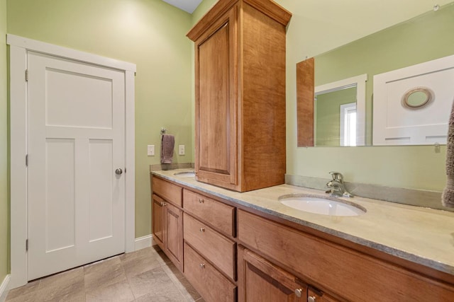 6570 Chester Ave, Webster Twp, MN 55057 - bathroom with double vanity, baseboards, and a sink