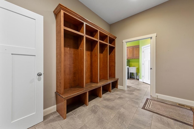 6570 Chester Ave, Webster Twp, MN 55057 - mudroom featuring baseboards and a sink