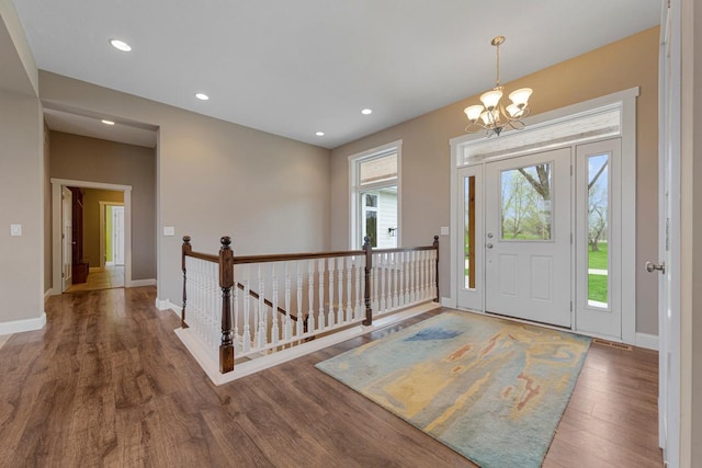 6570 Chester Ave, Webster Twp, MN 55057 - entrance foyer featuring baseboards, recessed lighting, wood finished floors, and a chandelier