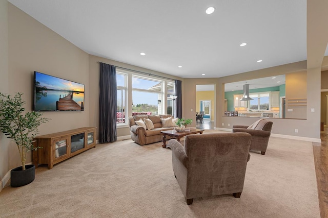 6570 Chester Ave, Webster Twp, MN 55057 - living area featuring baseboards, a wealth of natural light, recessed lighting, and light colored carpet