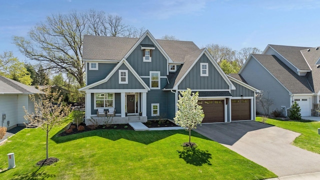 craftsman-style house with board and batten siding, driveway, an attached garage, a porch, and a front lawn