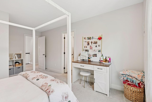 bedroom featuring baseboards and light carpet