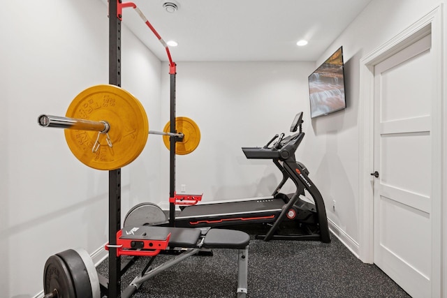 exercise room featuring baseboards and recessed lighting