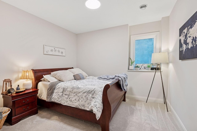carpeted bedroom featuring baseboards