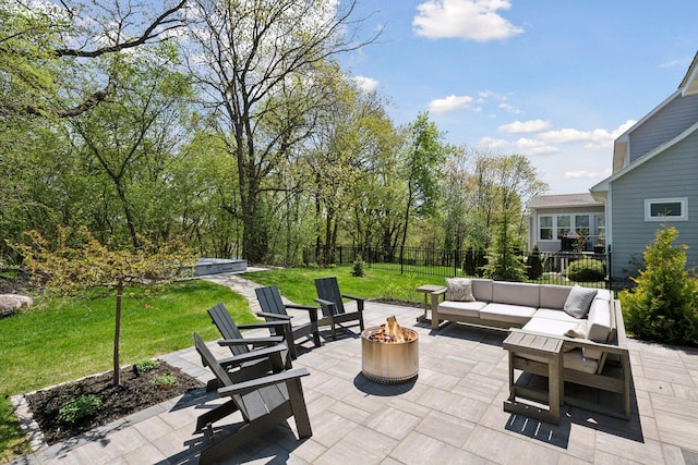 view of patio / terrace with an outdoor living space with a fire pit and fence