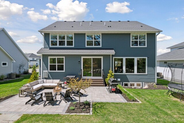 back of house with a trampoline, a patio, entry steps, cooling unit, and an outdoor hangout area