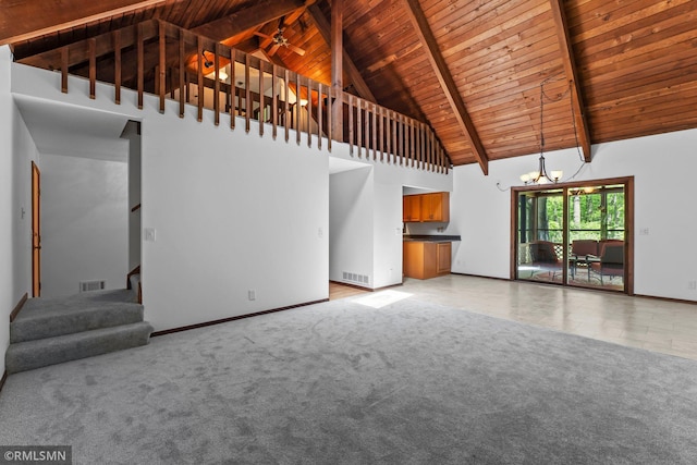 19405 Parkview Ave N, Scandia, MN 55073 - unfurnished living room with a wooden ceiling with exposed beams, a chandelier, high vaulted ceiling, stairway, and light carpet