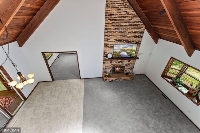 19405 Parkview Ave N, Scandia, MN 55073 - unfurnished living room with a wooden ceiling with exposed beams, a fireplace, and high vaulted ceiling