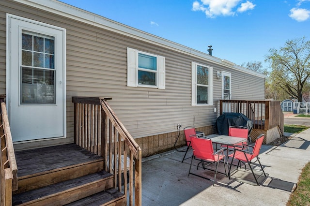 5702 Cabot Dr, Mounds View, MN 55112 - view of patio / terrace with grilling area and outdoor dining space