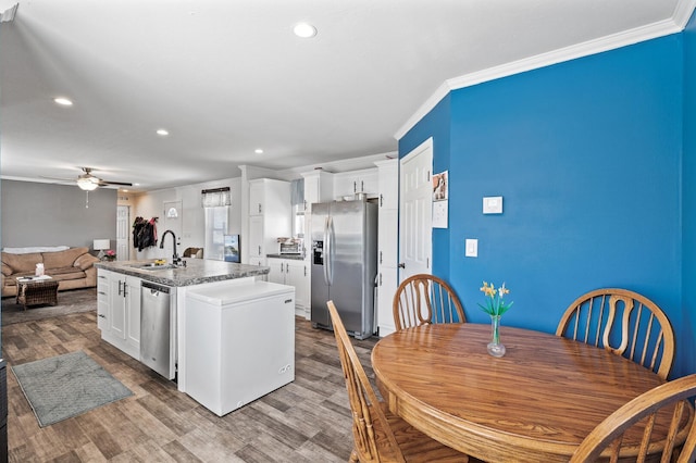 5702 Cabot Dr, Mounds View, MN 55112 - kitchen featuring crown molding, stainless steel appliances, recessed lighting, and a sink