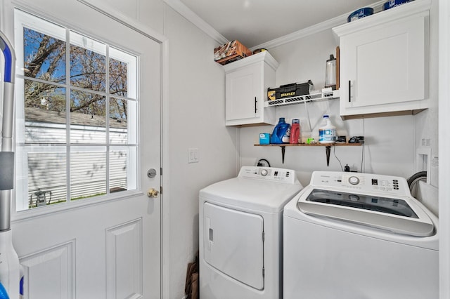 5702 Cabot Dr, Mounds View, MN 55112 - washroom featuring crown molding, cabinet space, plenty of natural light, and washing machine and clothes dryer