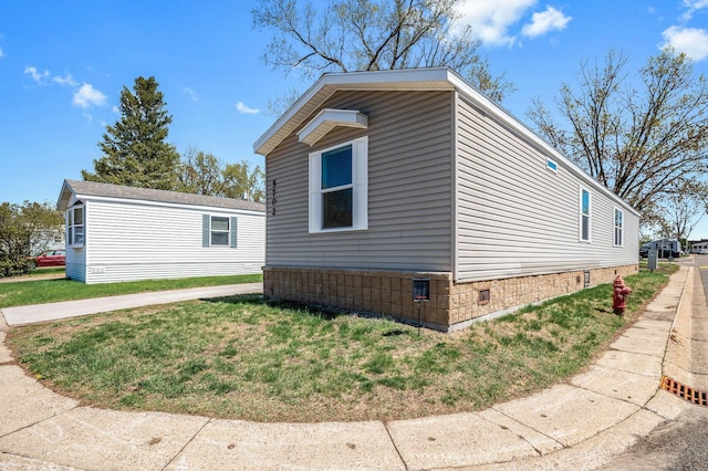 5702 Cabot Dr, Mounds View, MN 55112 - view of side of property featuring a yard