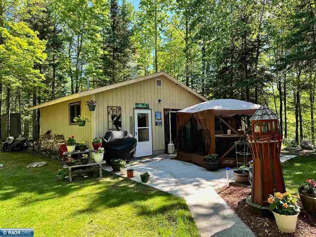 exterior space featuring a gazebo and a yard