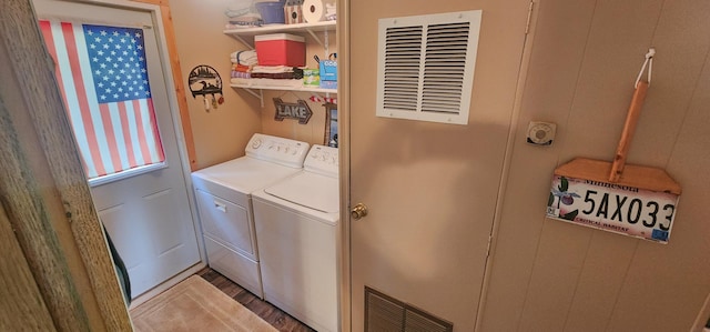30280 County Highway 26, Holmesville Twp, MN 56501 - washroom featuring visible vents, washer and clothes dryer, laundry area, and light wood-style flooring