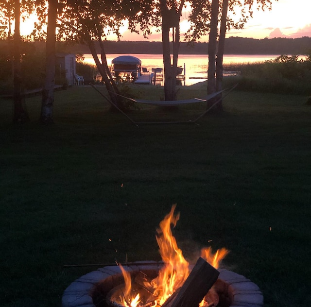 30280 County Highway 26, Holmesville Twp, MN 56501 - view of yard featuring a fire pit and a water view