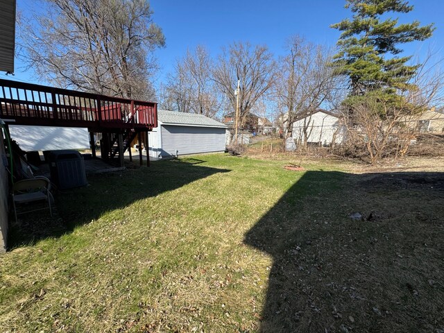 view of yard with a wooden deck and stairs