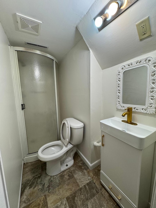 bathroom featuring toilet, baseboards, visible vents, a shower stall, and vanity